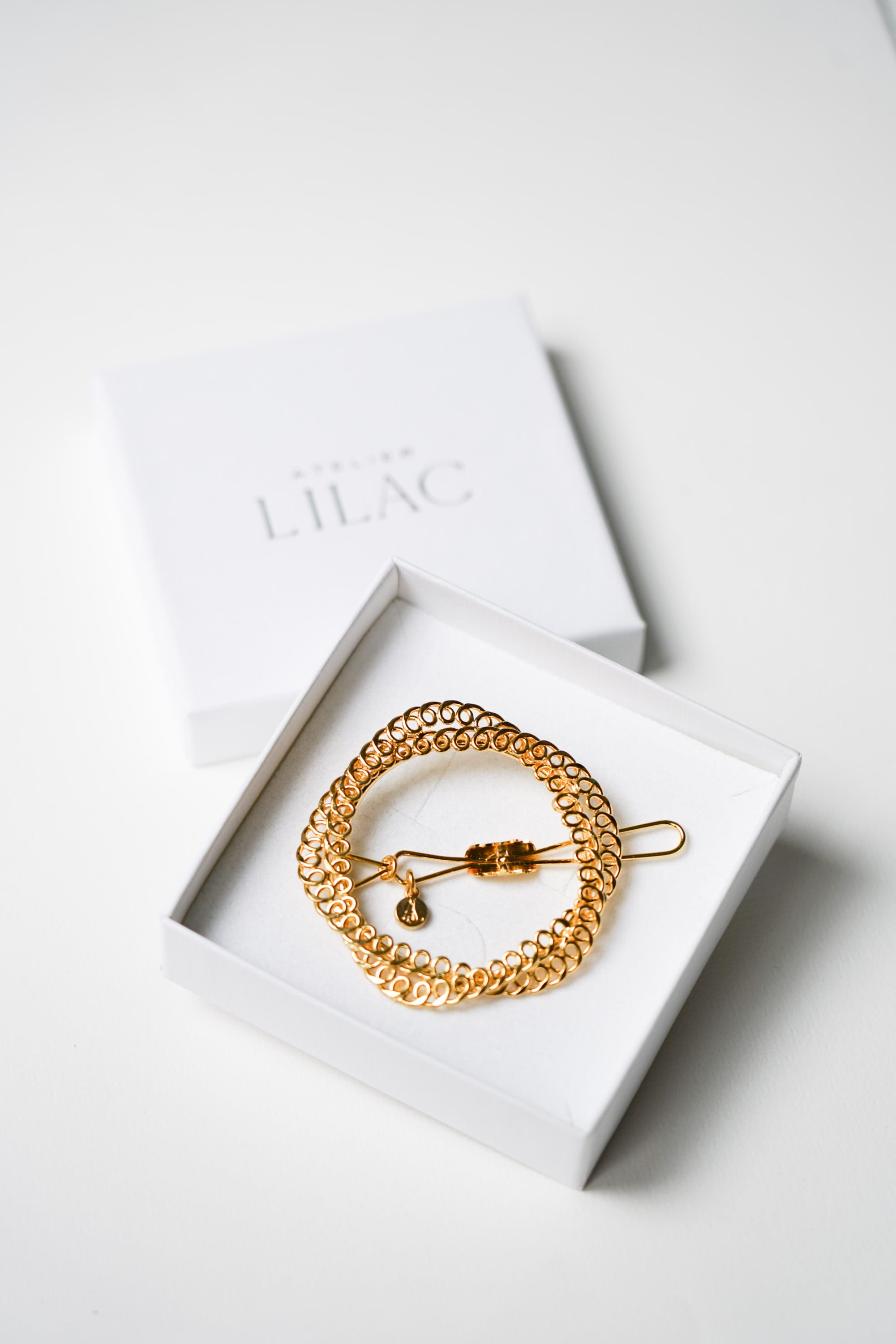 Barrette à double cercles torsadés dorés