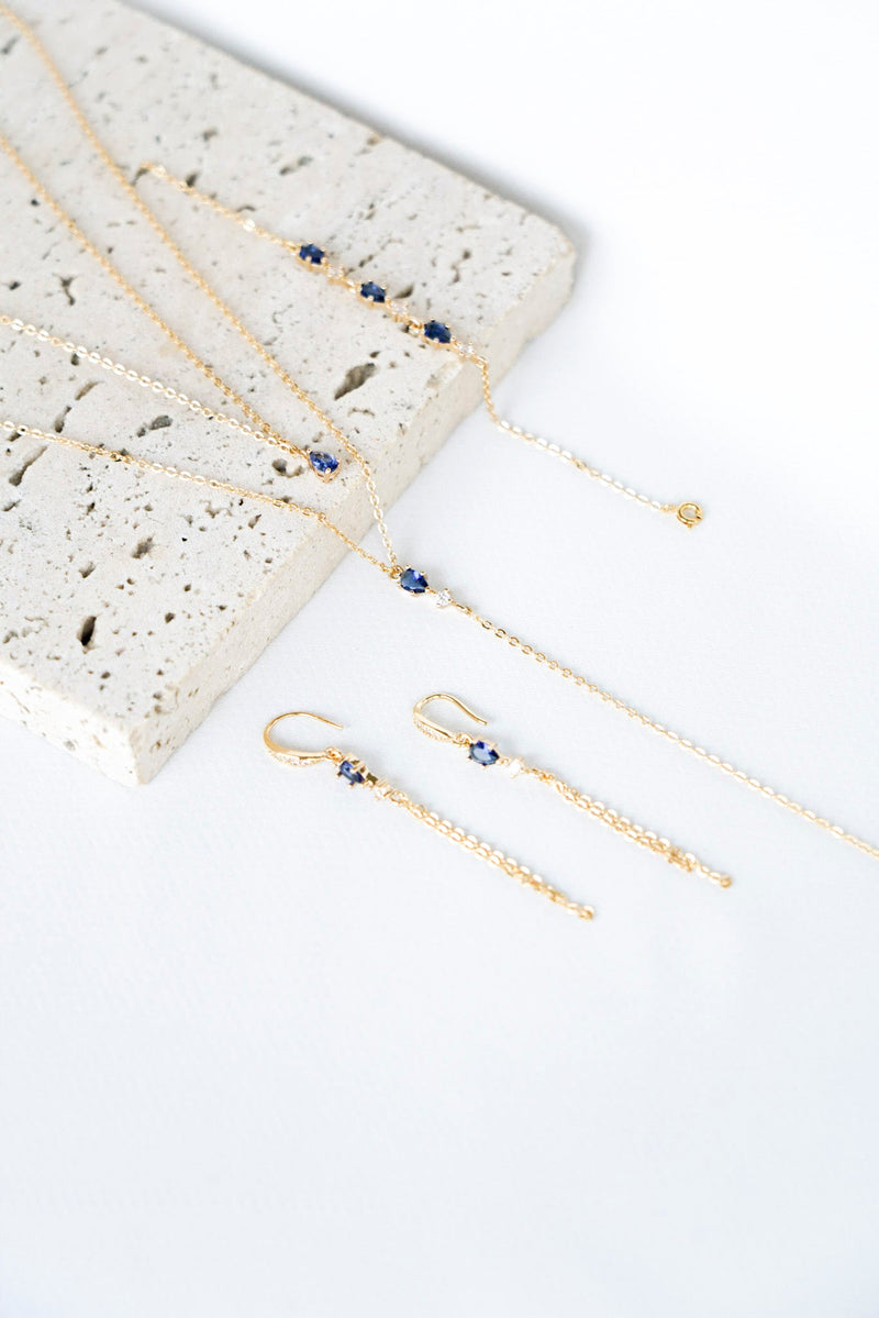 Collier de dos, bracelet et boucles d'oreilles pendantes de mariage couleur or avec un cristal de verre bleu