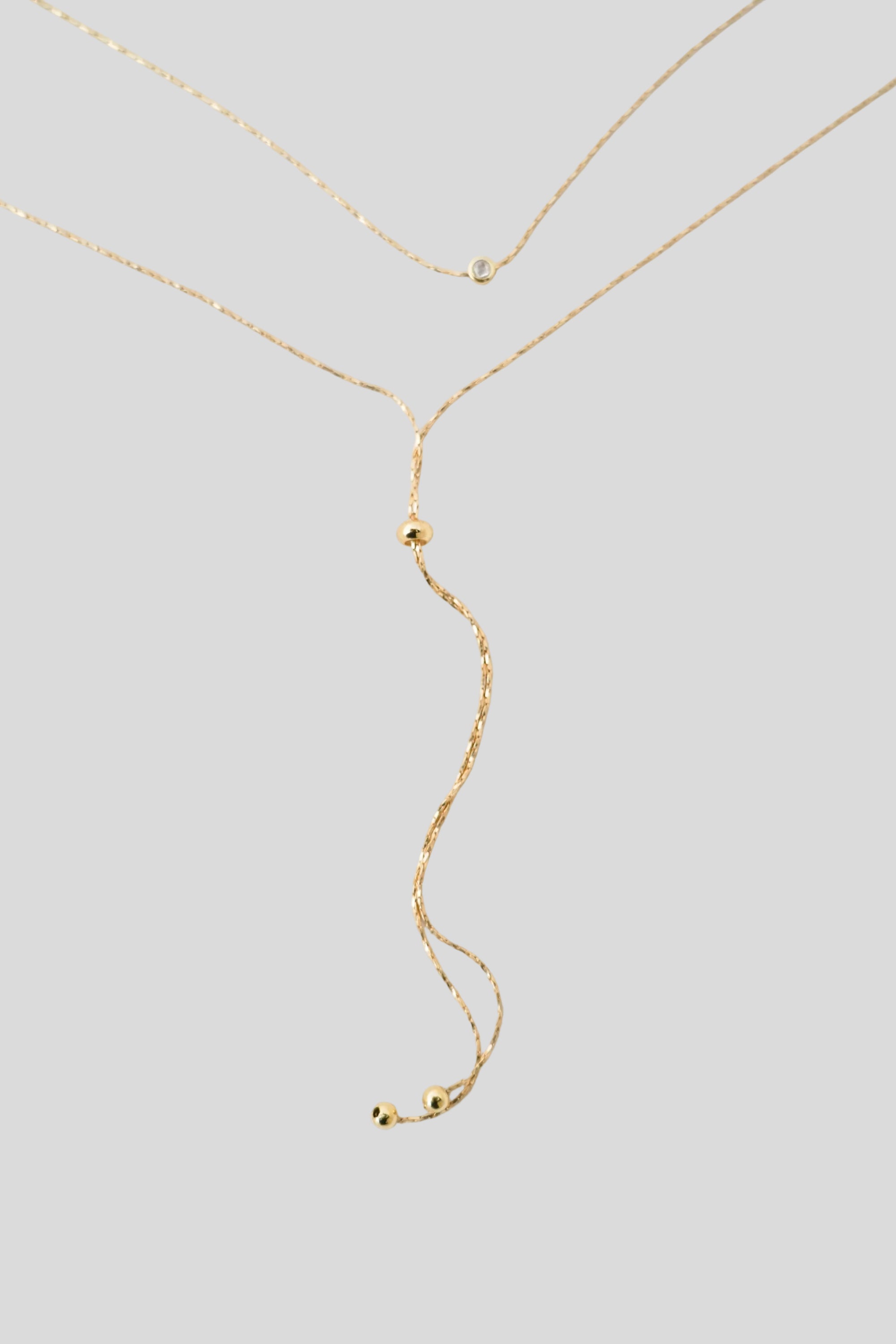 Collier de dos chaîne serpent torsadée et billes