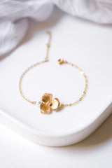 Bracelet fleuri or et perle