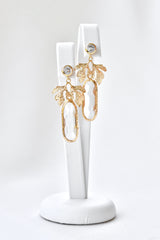 Boucles d'oreilles de mariage pendantes en or avec long cristaux transparent ovale