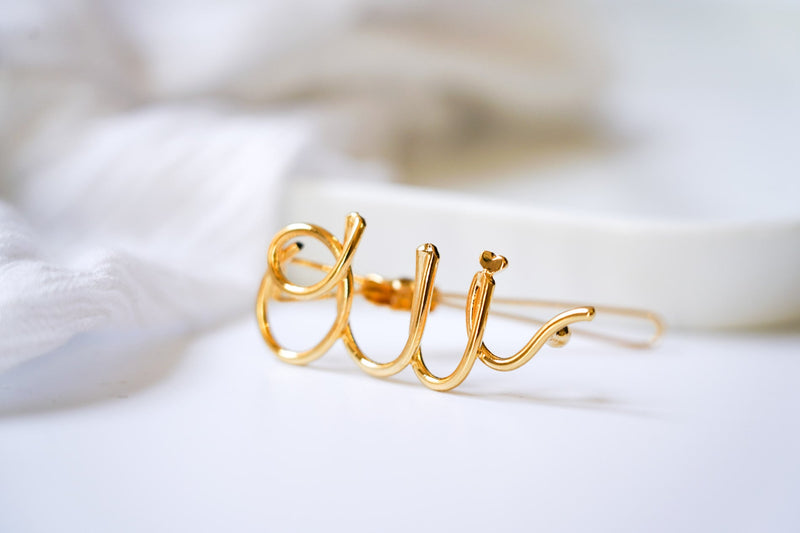 bijou de cheveux pour mariage avec l'inscription OUI en or